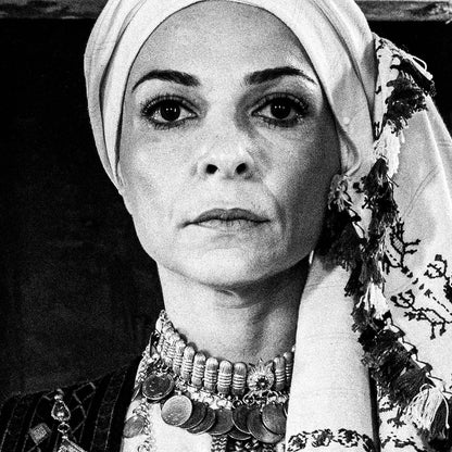 Three women in traditional attire standing in a doorway. Kyparissia, Peloponnese, Greece. Black and white photography close-up detail by George Tatakis.
