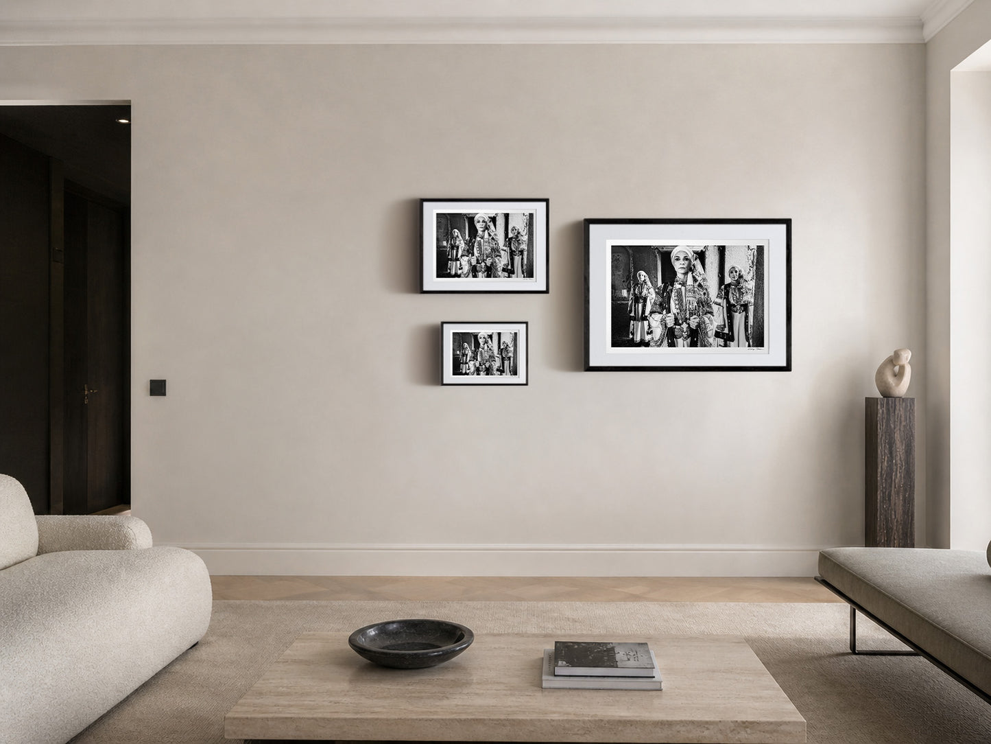 Three women in traditional attire standing in a doorway. Kyparissia, Peloponnese, Greece. Black and white photography frame sizing by George Tatakis.