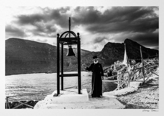 Black and White Photography Wall Art Greece | Priest striking the bell at St. John celebration in Vrykounta Olympos Karpathos Dodecanese by George Tatakis