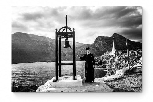 Black and White Photography Wall Art Greece | Priest striking the bell at St. John celebration in Vrykounta Olympos Karpathos Dodecanese by George Tatakis - whole photo